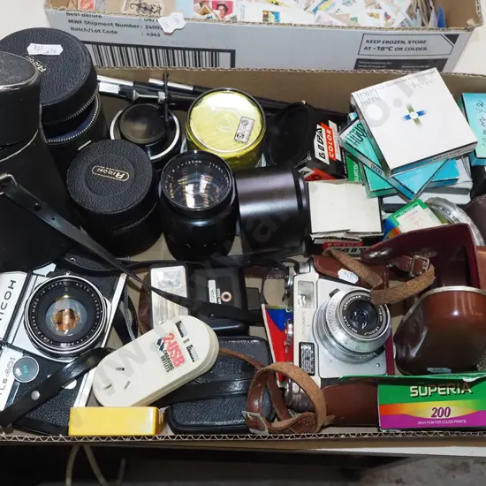 box of photographic accessories; cameras, films, lenses etc