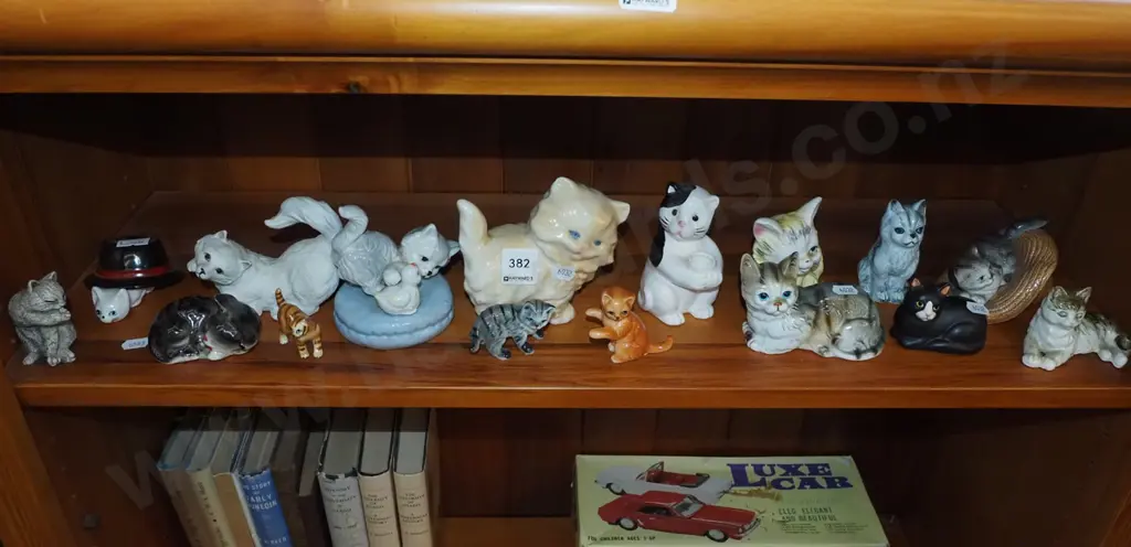 shelf of cat figurines Image 1++
