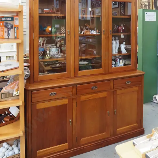 solid rimu Davies Furniture bookcase chiffonier with 3 glazed doors and adjustable shelves on top over 3 drawers and 