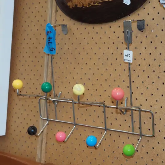 reproduction chrome and plastic coat hooks -signs of tarnishing