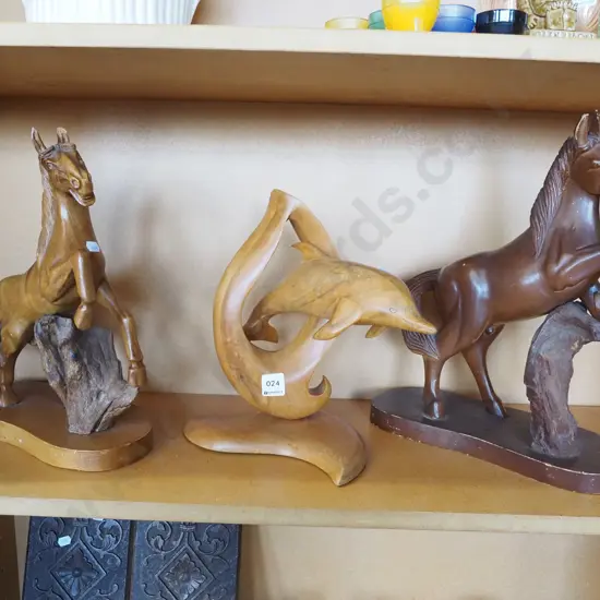 3x carved wooden figurines; 2x horses, 1x dolphin