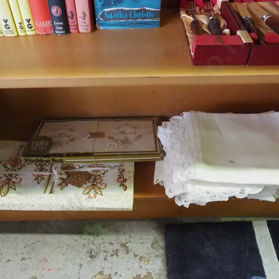 shelf of tablecloths, as new old linen