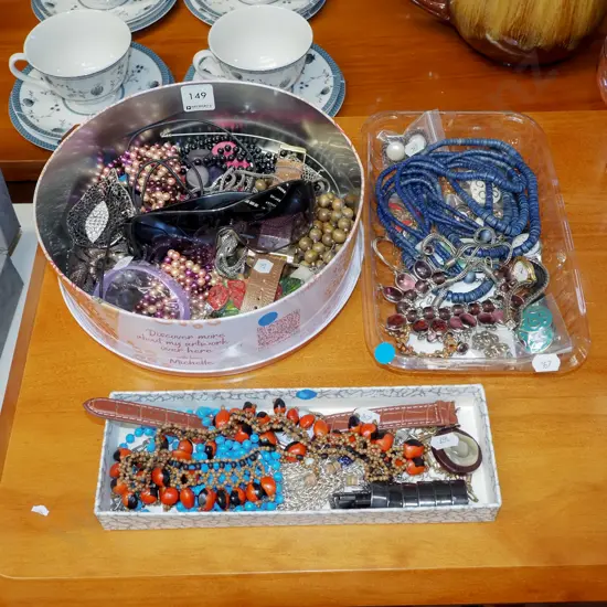 tin tray and box of costume jewellery 