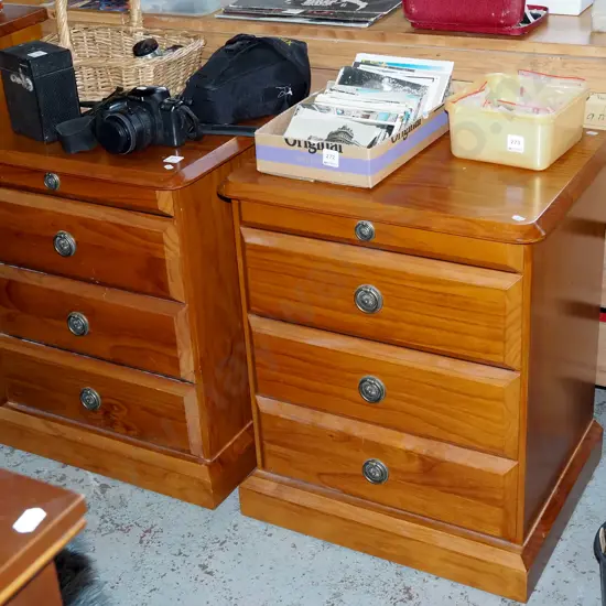 pair of pine 3 drawer matching bedside cabinets with drop handles and pull out trays