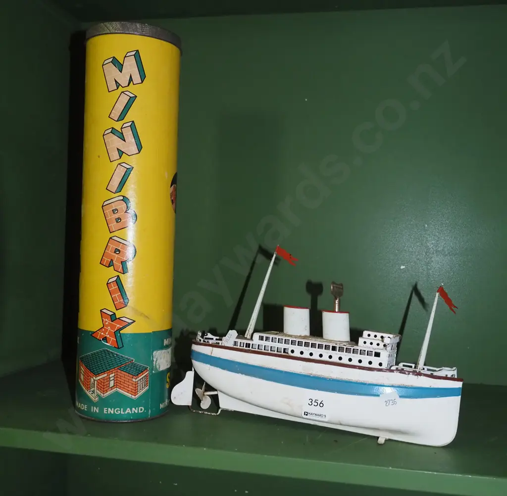clockwork tin boat, lidded canister of mini bricks Image 1++