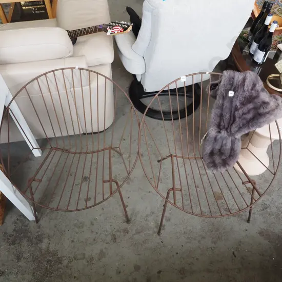 pair of metal moon chairs - some rust