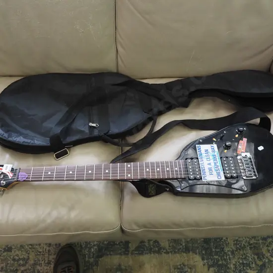 electric guitar that has been cut down, carry bag