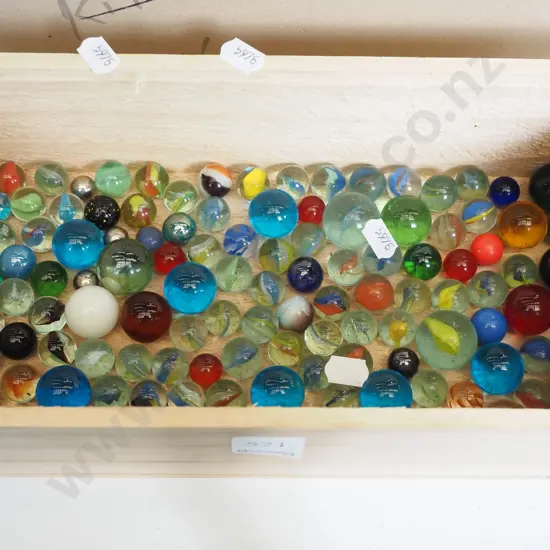 wooden box and marbles