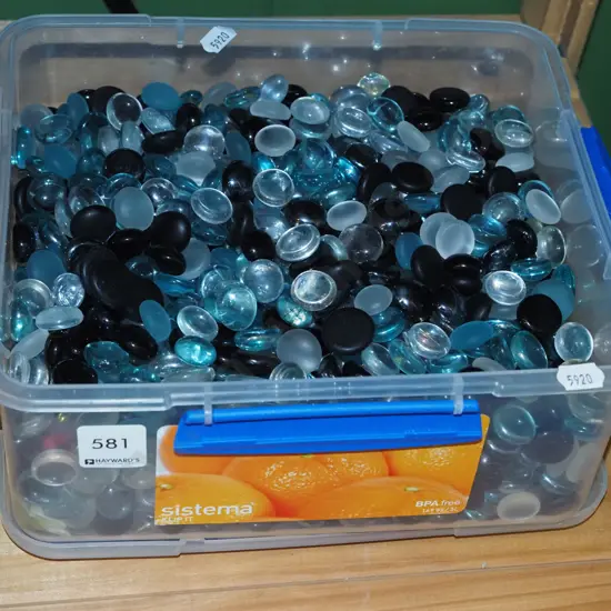 plastic tub of glass beads