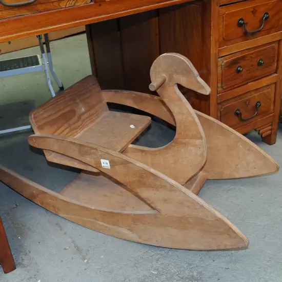 child's riding on rocking swan