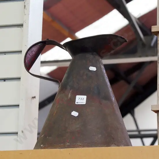 rusty beaten wash jug