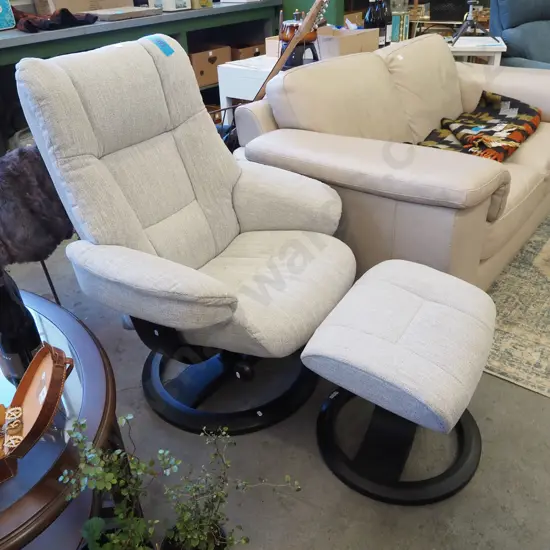 swivel recining armchair with matching footstool with fawn upholstery - excellent condition