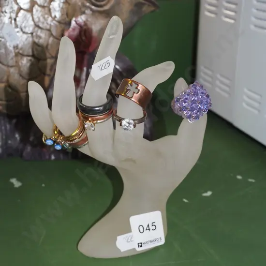 glass hand ring stand (chip to one fingernail) and various rings H180