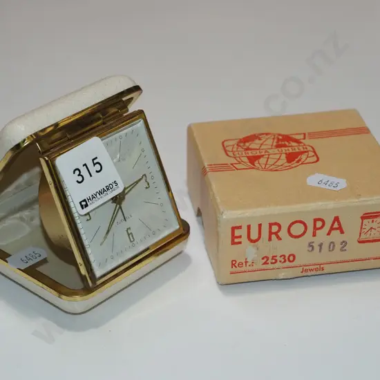 cased travel alarm clock