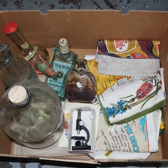 box: tea towels, miniature microscope, stoppered glass flagon, etc