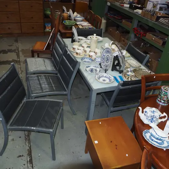 glass and alloy outdoor table with 6 upholstered chairs - chairs need a clean and are faded H715 W510 D880