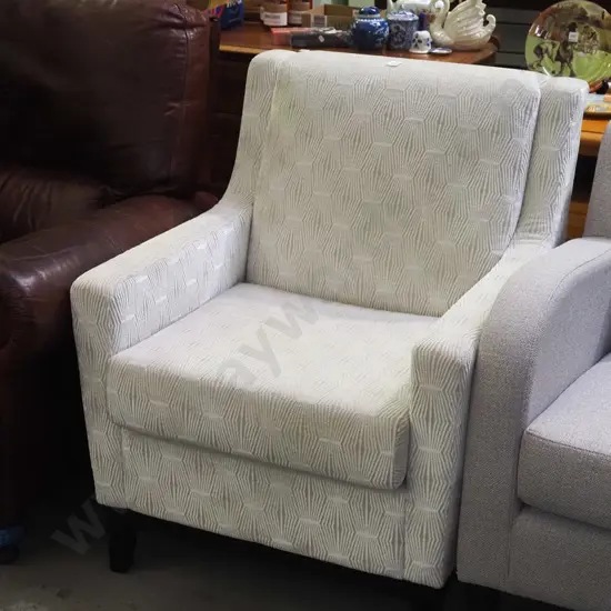 patterned cream upholstered armchair - very good condition