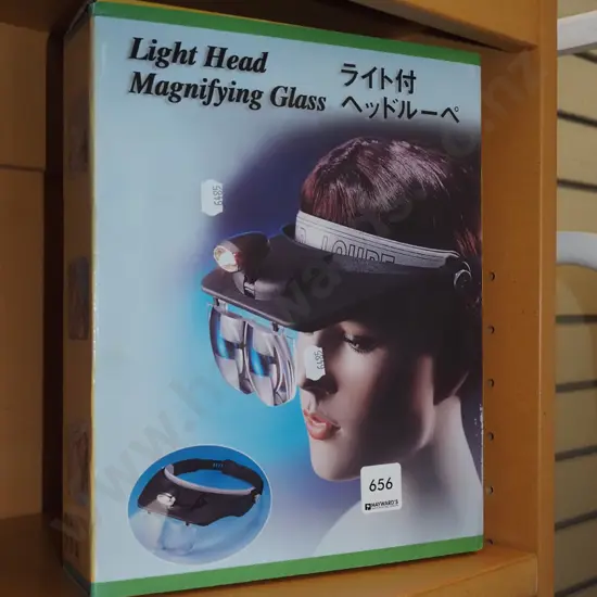 boxed as new light head magnifying glass
