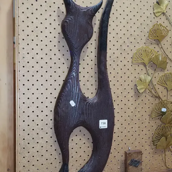 carved wooden cat wall art
