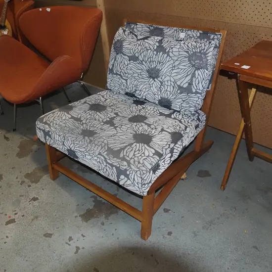 wood and floral low seated reception chaiir - fading to upholstery