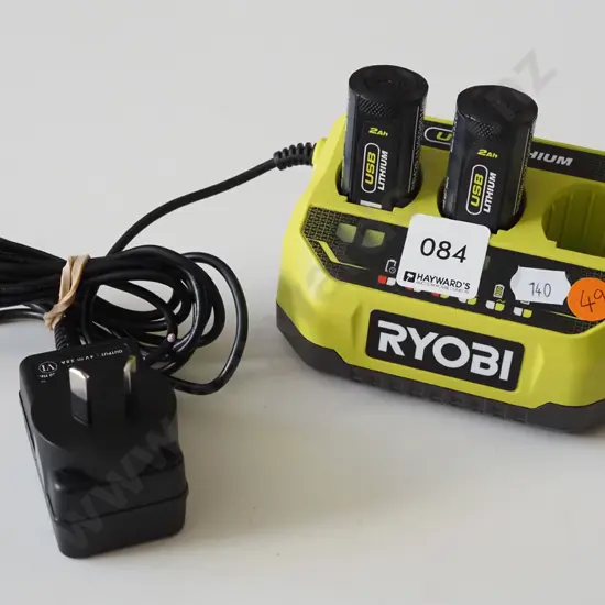 Ryobi black and green battery charging dock with two batteries
