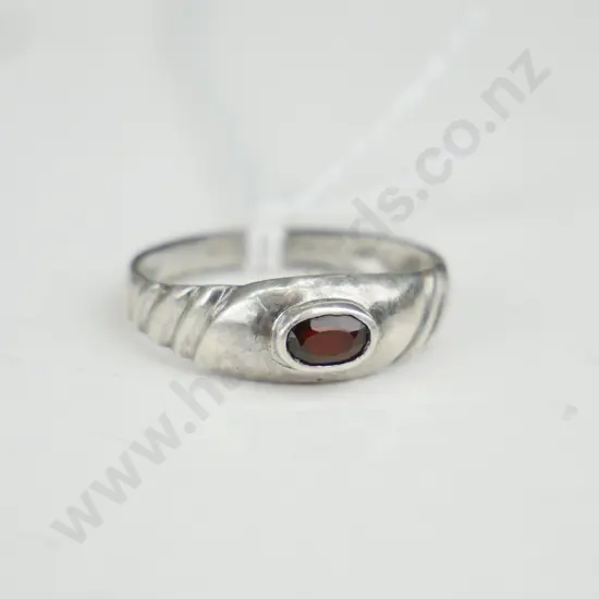 Silver ring with brownish coloured stone