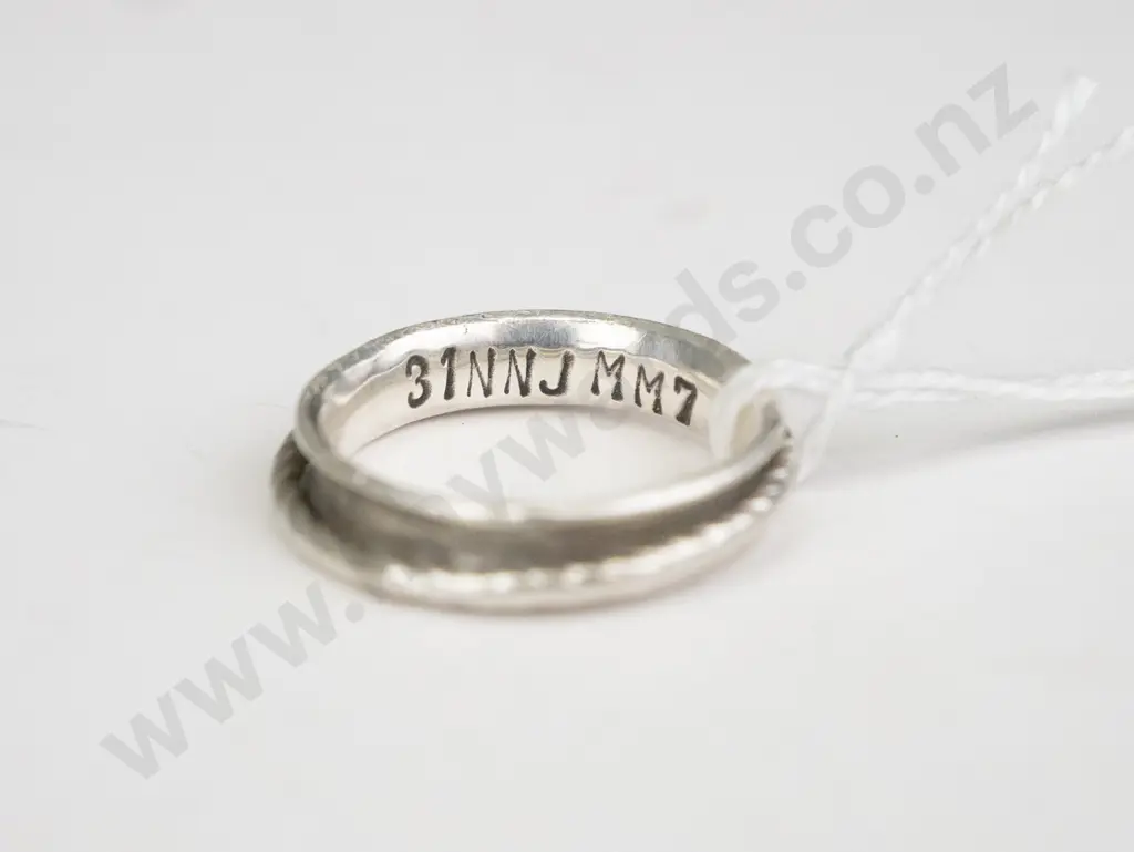 Silver ring with spinning parts, engraved inside with 31NNJMM7 Image 1++
