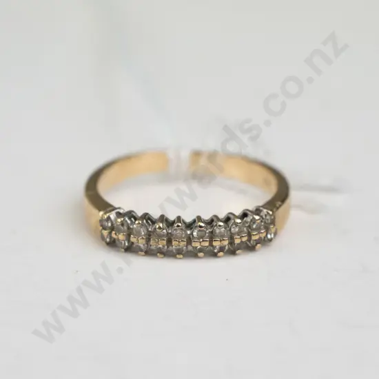 Small gold ring with 10 diamond like gems