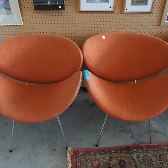 2x orange upholstered lip chairs - fading to fabric