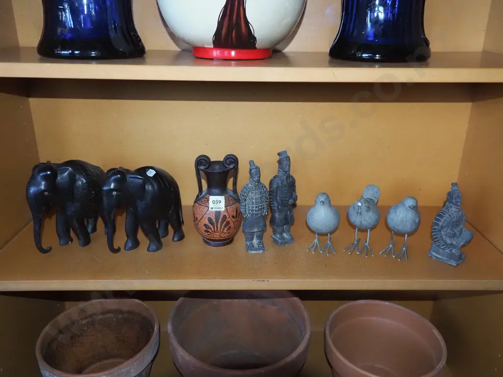 shelf; elephant figurines, warrior figurines etc - damage to bird figurine beaks Image 1++