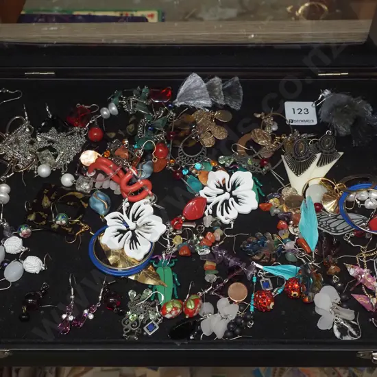 glass lidded jewellery box and costume jewellery contents