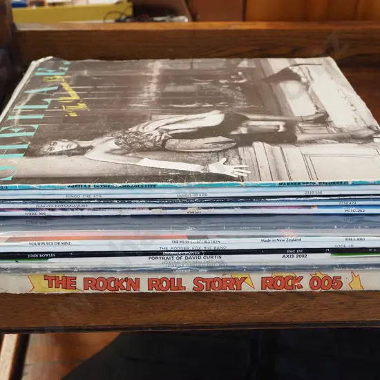 stack of LPs; Robert Plant, Ringo Starr etc