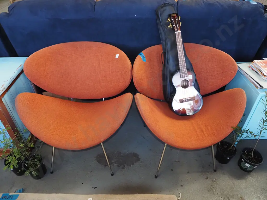 2x orange upholstered lip chairs Image 1++