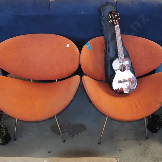 2x orange upholstered lip chairs
