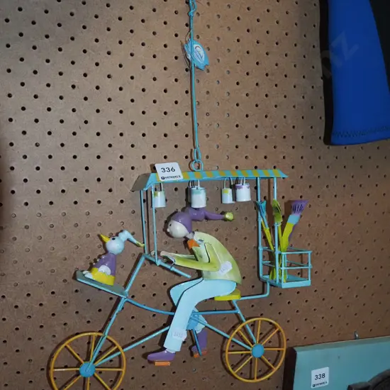 metal hanging figurine - person on bike
