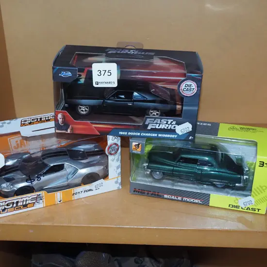 3x boxed diescast model vehicles