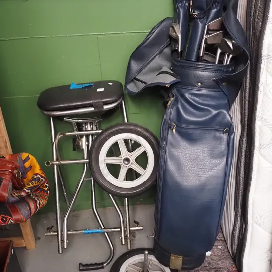 golf clubs and trundler