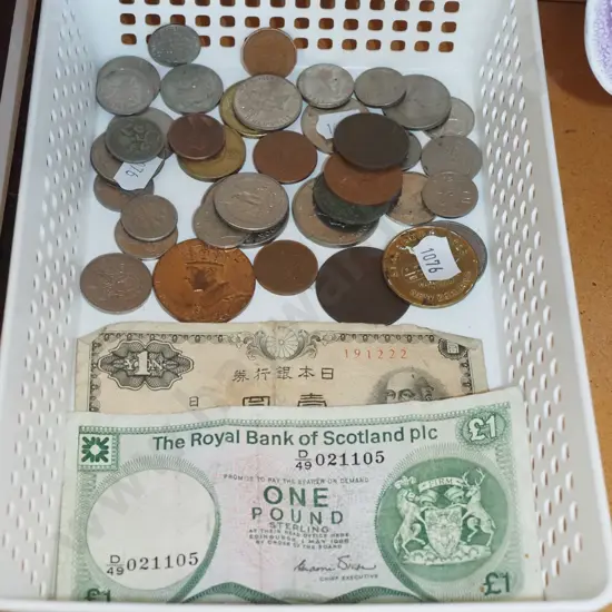 tray of notes and coins