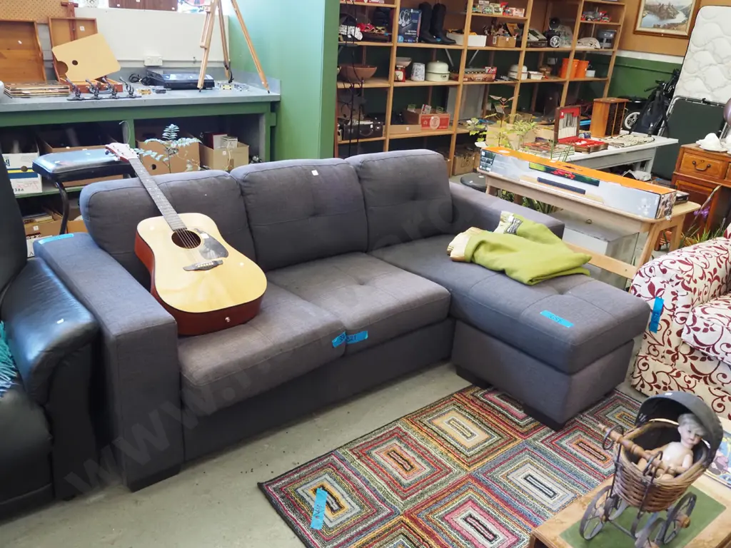 charcoal upholstered L shaped couch - significant fading - L shape can be moved around Image 1++