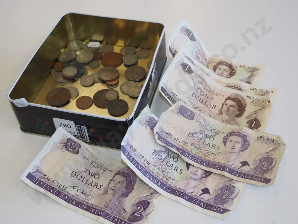 tin of bank notes and coins Image 1++