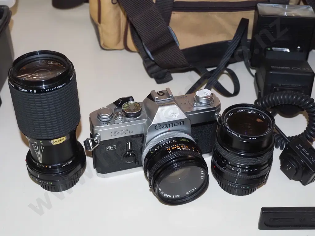 Canon FTB 35mm camera with lenses, flashes, bag Image 1++