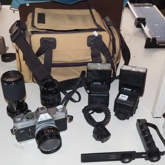 Canon FTB 35mm camera with lenses, flashes, bag