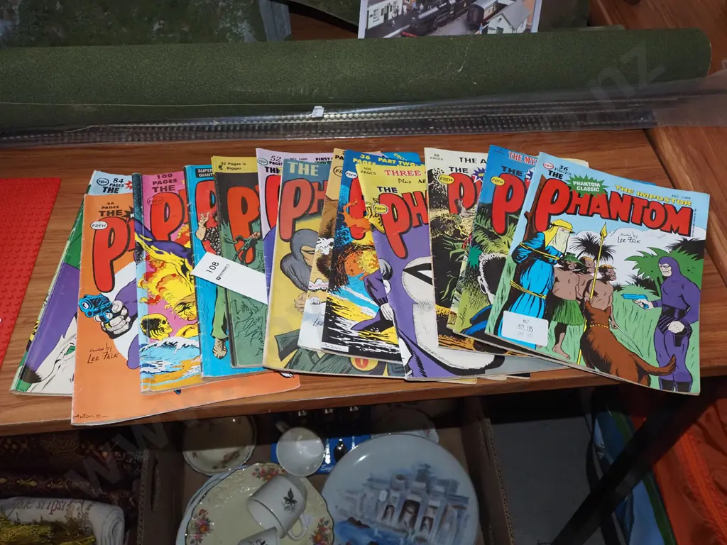 stack of Phantom comics Image 1++