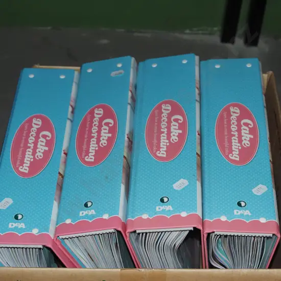box; cake decorating magazines in folders