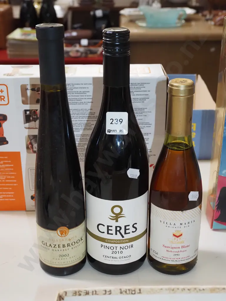 3x bottles of wine; sauvignon blanc 1993, pinot noir 2010, riesling 2002 Image 1++