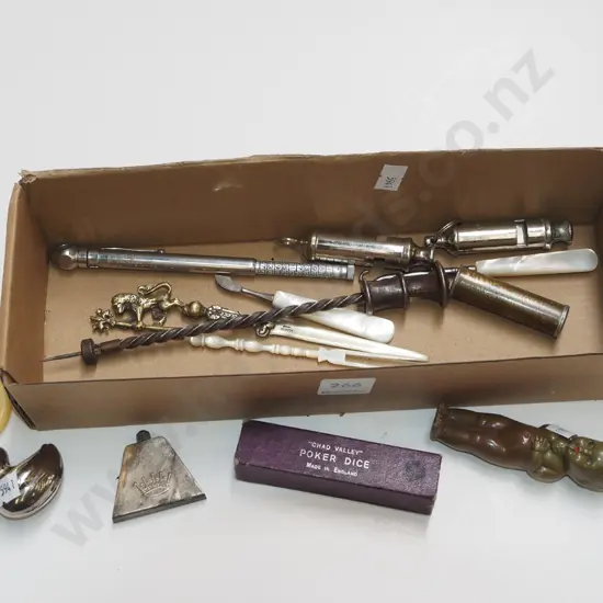 box; whistles, small doll, poker dice etc