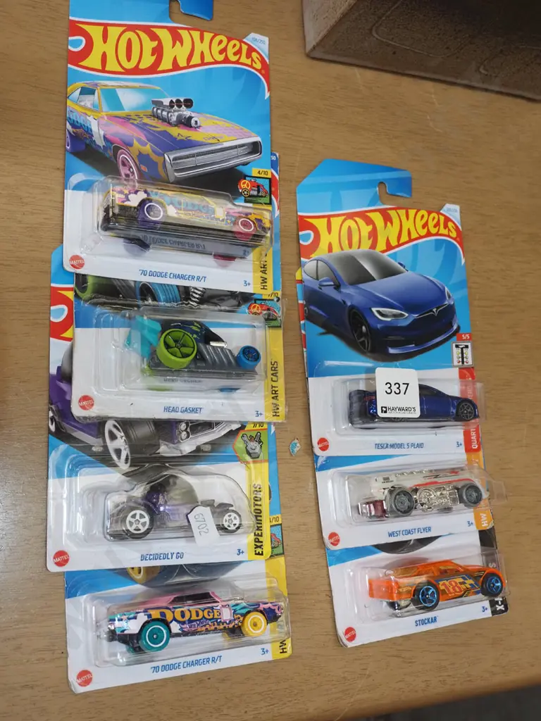 7x as  new carded Hotwheels vehicles Image 1++