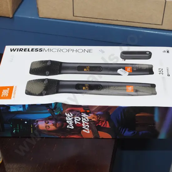 box; pair of JBL wireless microphones