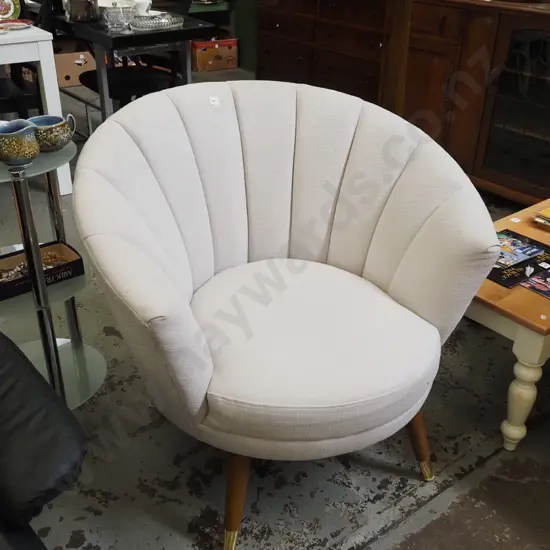 cream upholstered tub chair