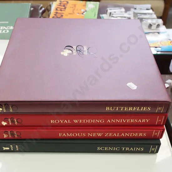 4 albums of collector stamp sets